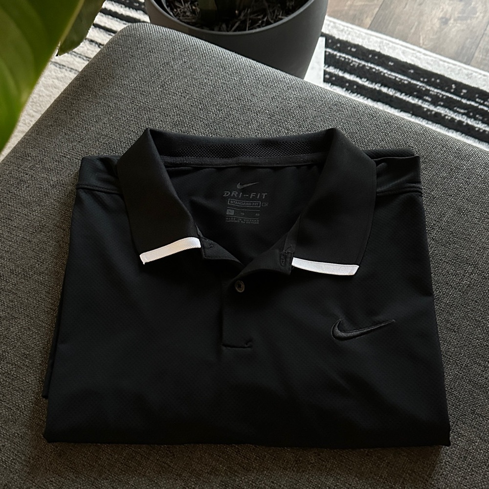 Nike Men's Black Polo Shirt with White Accents